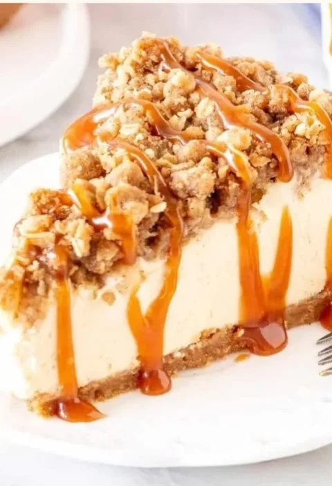 Delicious Apple Crisp Cheesecake with a crunchy topping and creamy filling