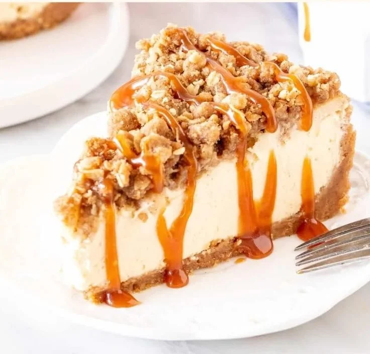 Delicious Apple Crisp Cheesecake with a crunchy topping and creamy filling