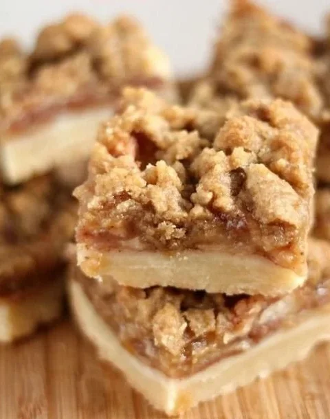 Delicious Apple Crisp Shortbread Bars on a wooden serving plate