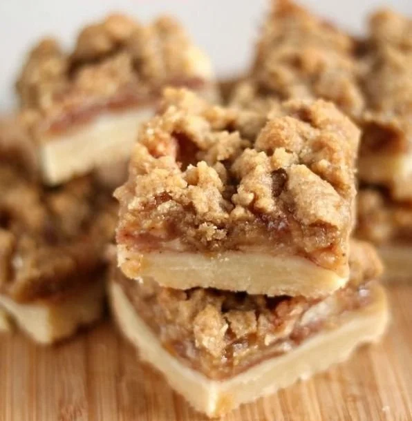 Delicious Apple Crisp Shortbread Bars on a wooden serving plate