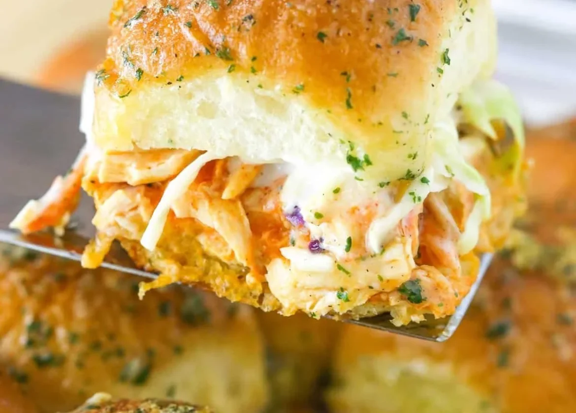 Baked Buffalo Chicken Sliders served with a side of ranch dressing