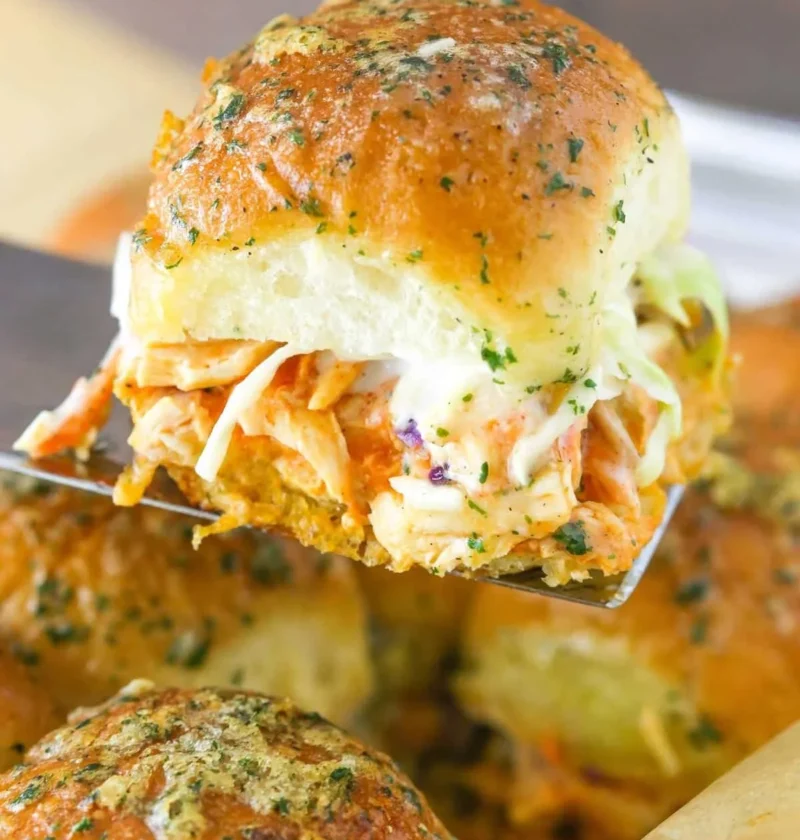 Baked Buffalo Chicken Sliders served with a side of ranch dressing