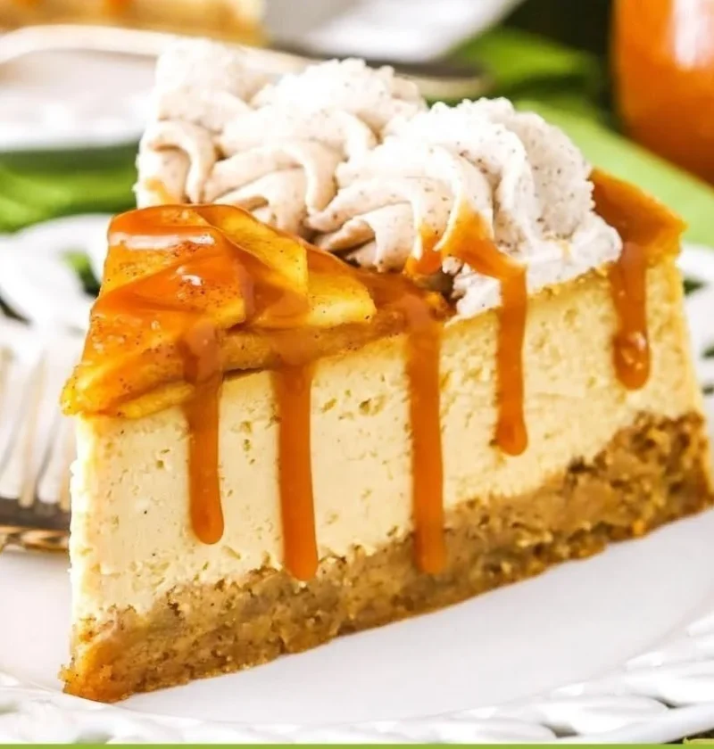 Delicious Caramel Apple Blondie Cheesecake topped with caramel sauce and apples