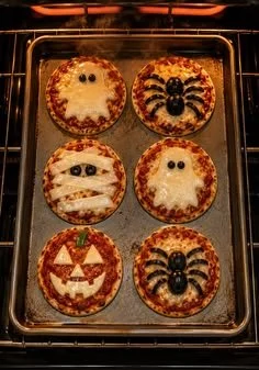 Plate of easy mini Halloween pizzas decorated for a spooky celebration