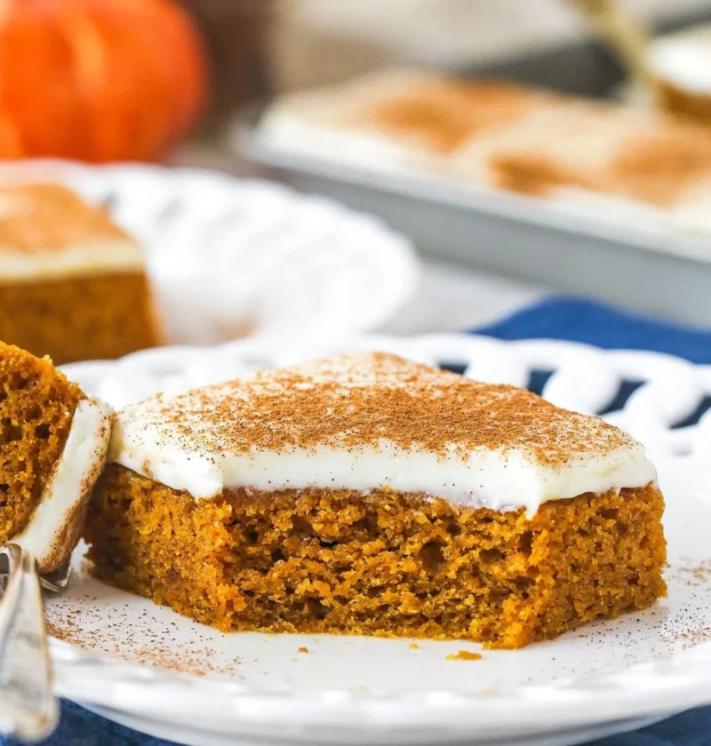 Delicious homemade pumpkin bars topped with cream cheese frosting.