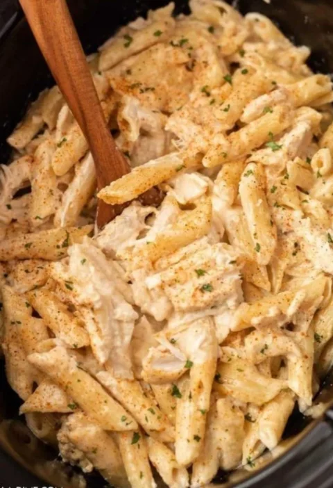 Bowl of Slow Cooker Cajun Chicken Pasta with herbs and spices
