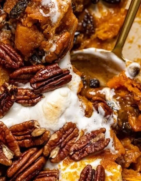 Southern Maple Sweet Potato Casserole topped with pecans and brown sugar