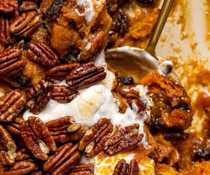 Southern Maple Sweet Potato Casserole topped with pecans and brown sugar