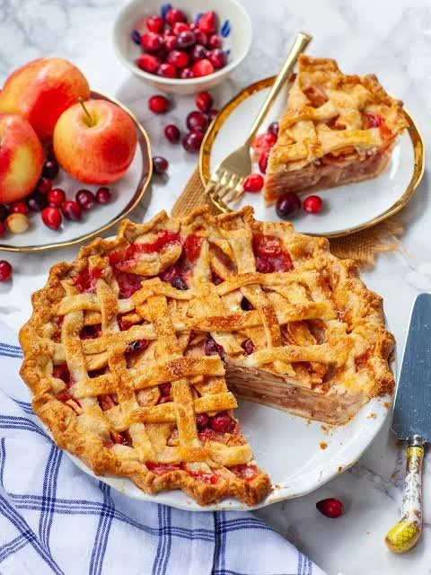 Golden brown apple pie with a flaky crust and apple filling