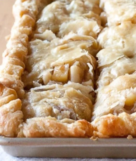 Delicious homemade apple pie with golden crust and apples