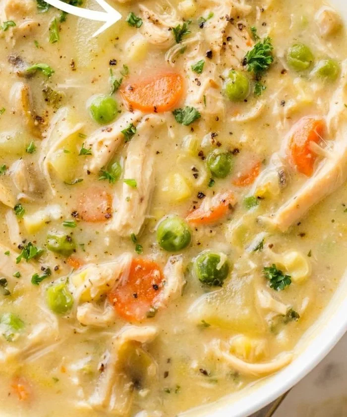 Delicious bowl of chicken pot pie soup topped with herbs