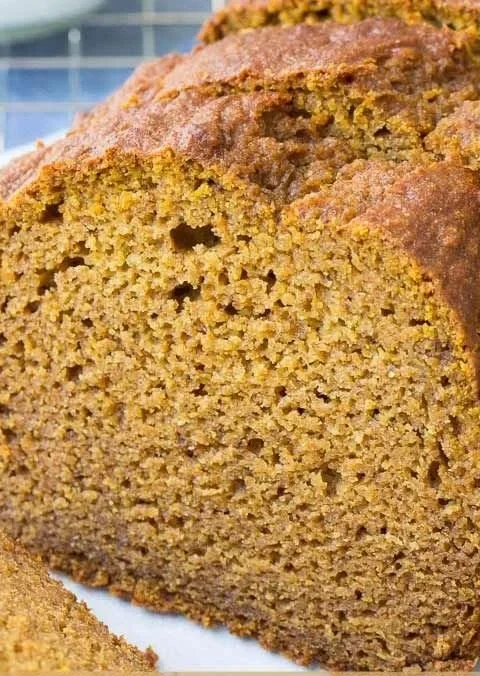 Delicious slice of healthy pumpkin bread on a wooden table