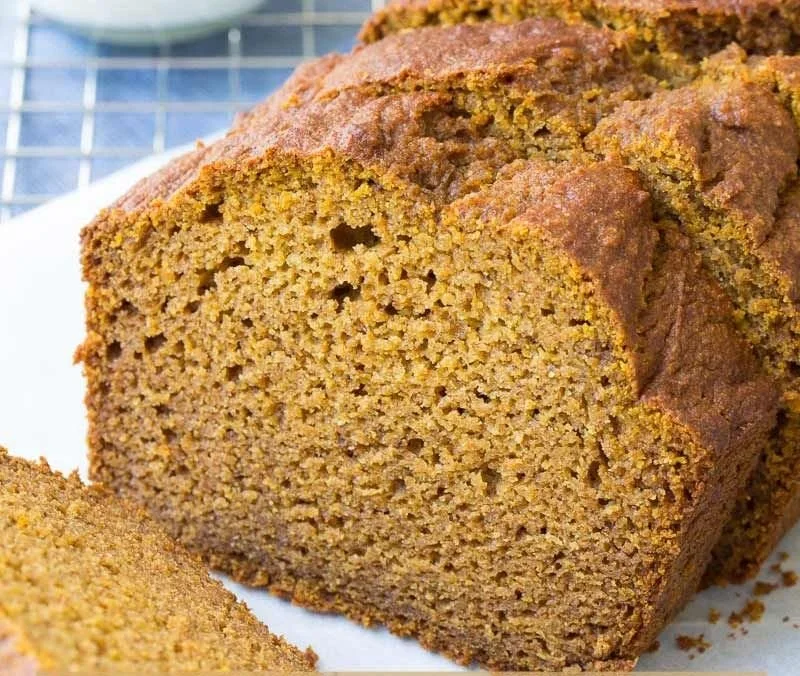 Delicious slice of healthy pumpkin bread on a wooden table