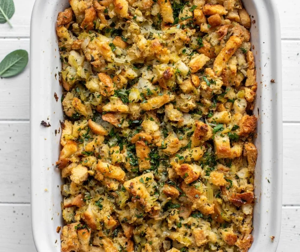 Delicious buttery herb stuffing displayed in a serving bowl.