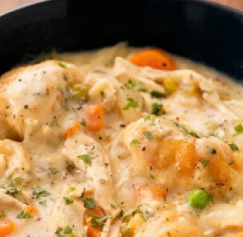 Creamy crockpot chicken and dumplings served in a cozy bowl