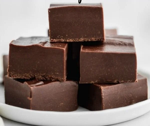 Delicious homemade fudge in a decorative box, perfect for gifts.