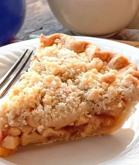 Delicious Dutch Apple Pie with slice served on a plate