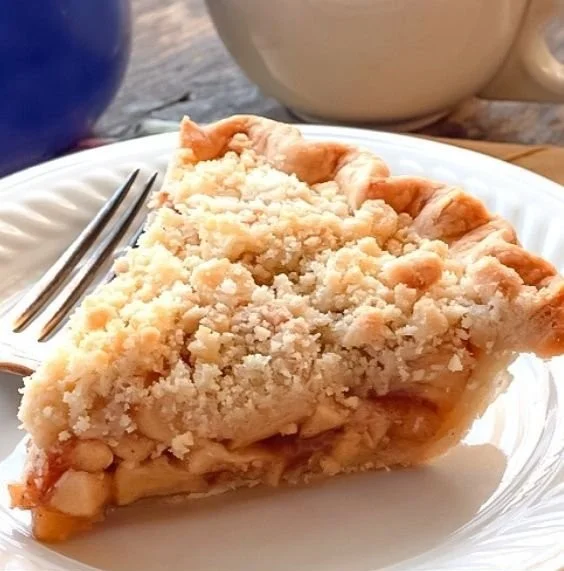 Delicious Dutch Apple Pie with slice served on a plate