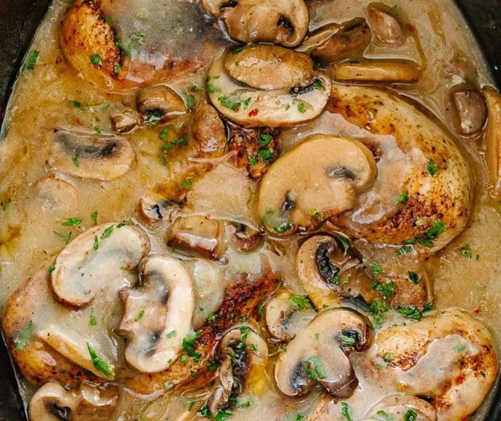 Delicious Easy Crock Pot Chicken Marsala served with mushrooms and herbs