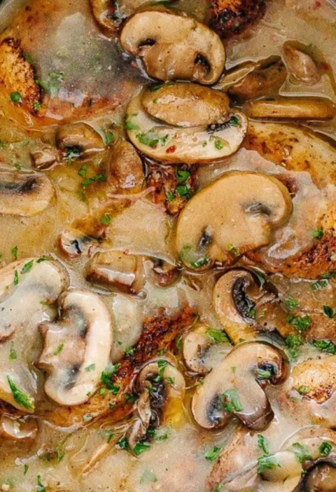 Delicious Easy Crock Pot Chicken Marsala served with mushrooms and herbs