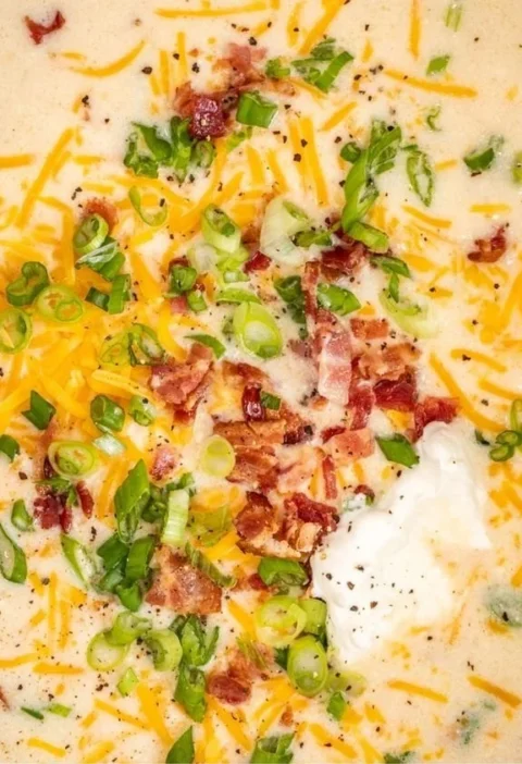 Easy crockpot potato soup in a bowl with toppings