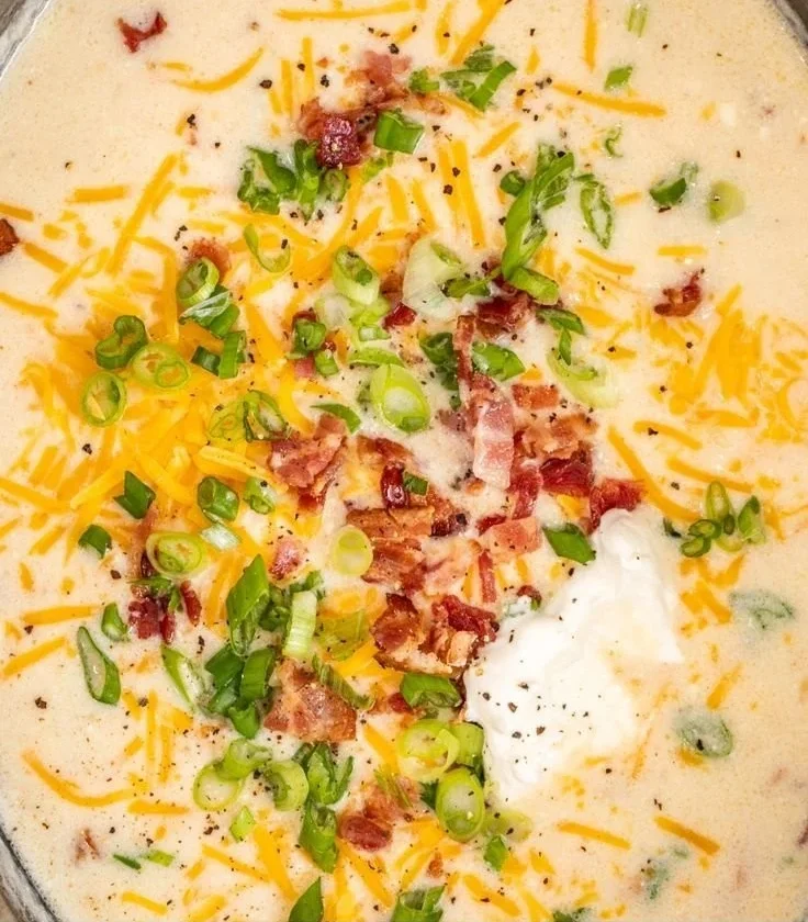 Easy crockpot potato soup in a bowl with toppings