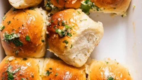 Homemade garlic bread rolls stuffed with butter and herbs