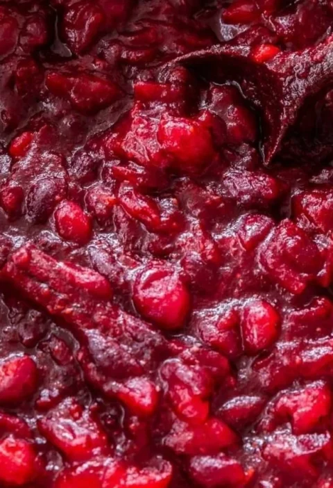 Honey Bourbon Cranberry Sauce served in a glass bowl