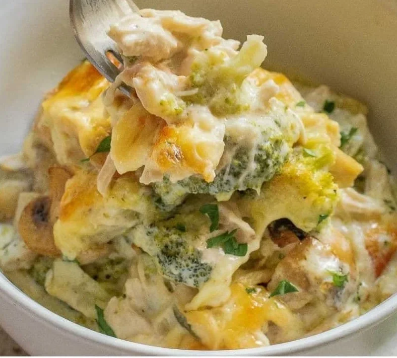 Cheesy Turkey and Broccoli Casserole topped with breadcrumbs in a baking dish.
