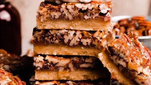 Delicious pecan pie bars topped with salted maple glaze, perfect for dessert.