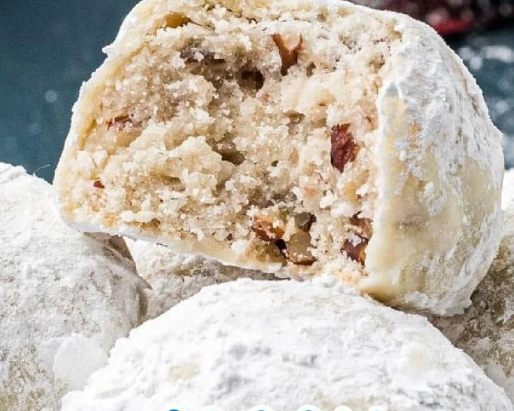 Delicious pecan snowball cookies dusted with powdered sugar