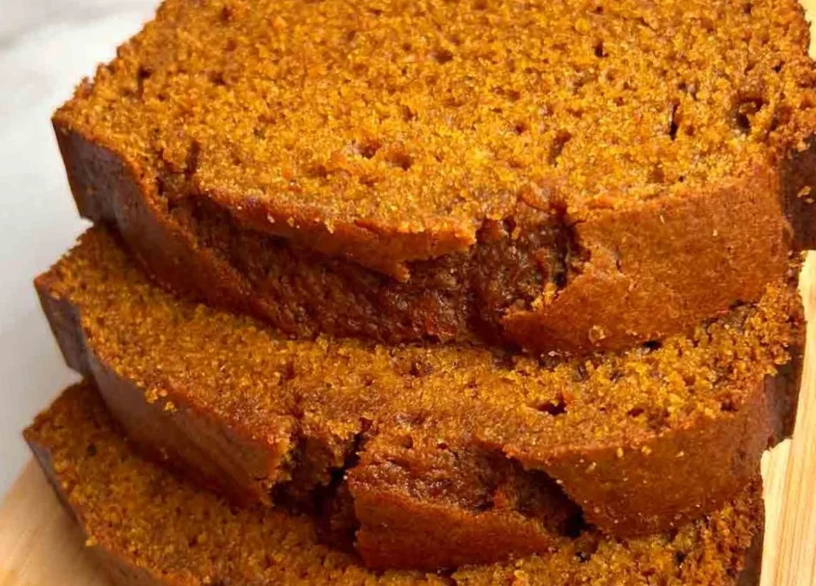 Loaf of delicious homemade pumpkin bread on a wooden table