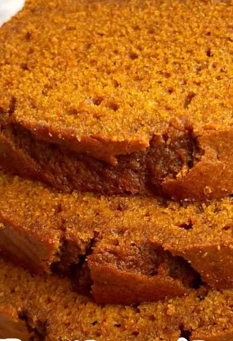 Loaf of delicious homemade pumpkin bread on a wooden table