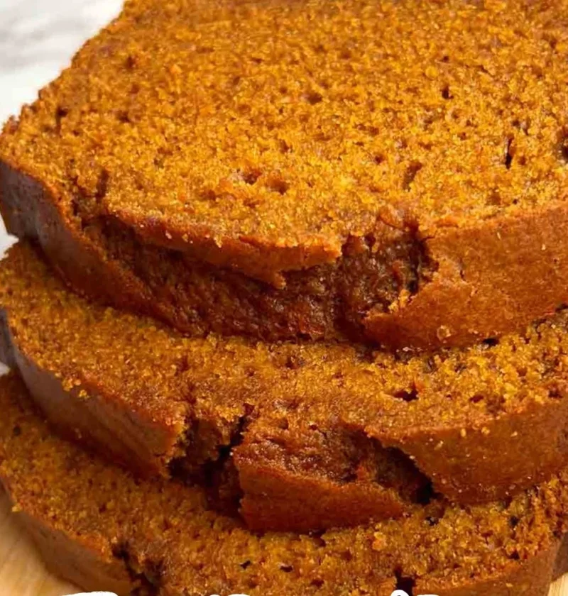 Loaf of delicious homemade pumpkin bread on a wooden table