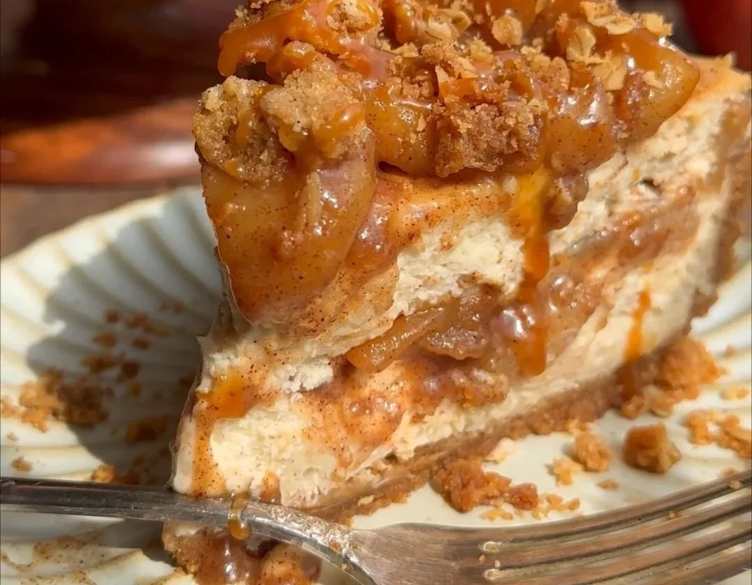 Delicious salted caramel apple pie cheesecake dessert with caramel drizzle