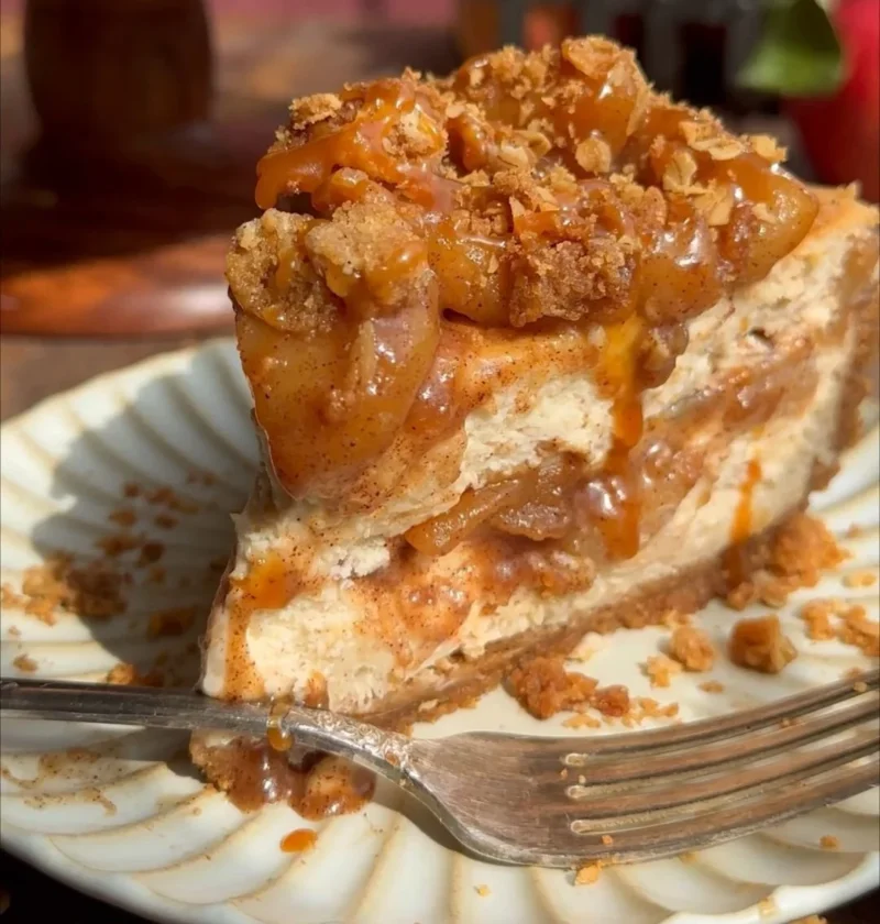 Delicious salted caramel apple pie cheesecake dessert with caramel drizzle
