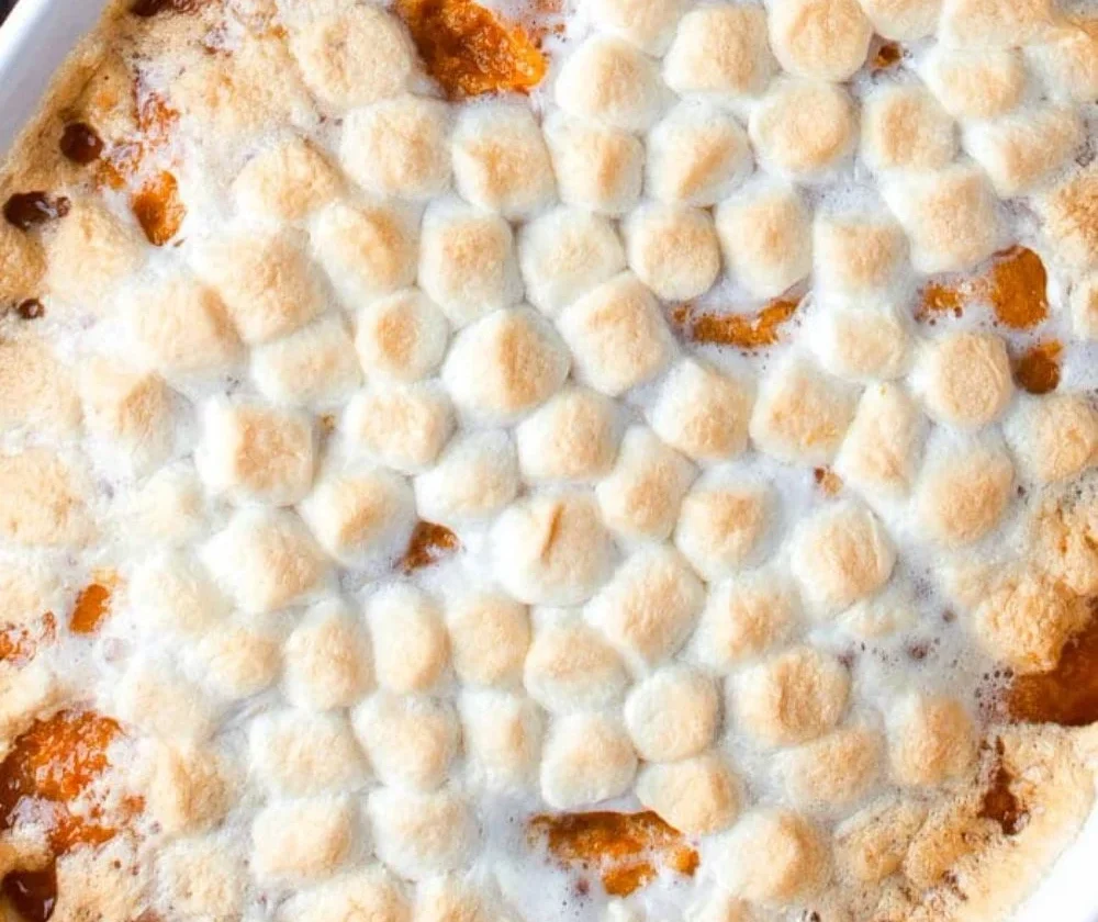 Delicious sweet potato casserole topped with marshmallows and pecans
