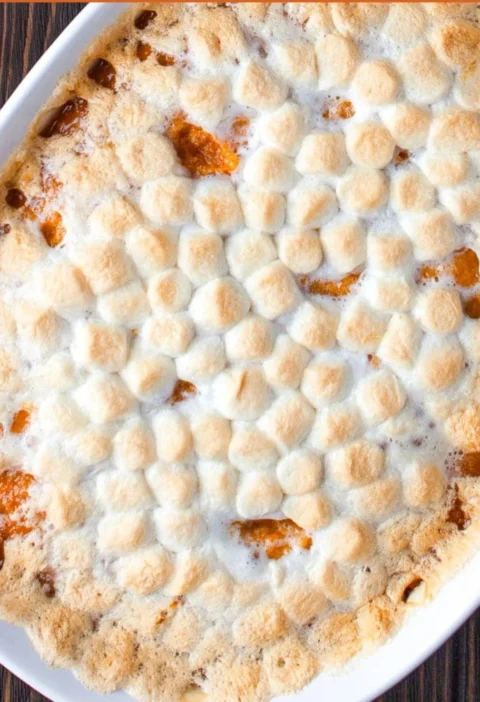 Delicious sweet potato casserole topped with marshmallows and pecans