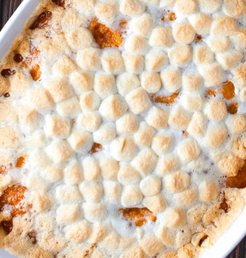 Delicious sweet potato casserole topped with marshmallows and pecans