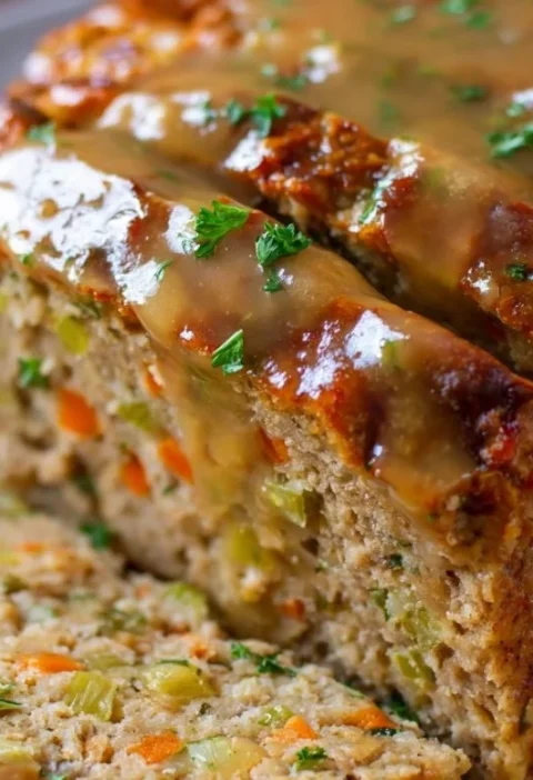 Delicious Turkey Meatloaf with Stuffing served on a plate with garnish