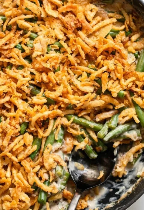 Delicious vegan green bean casserole topped with crispy fried onions
